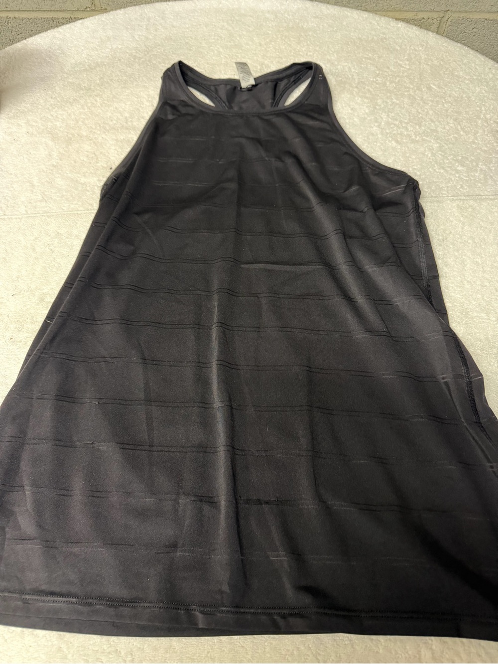 Athleta Sz M black racer back tank with vented design.